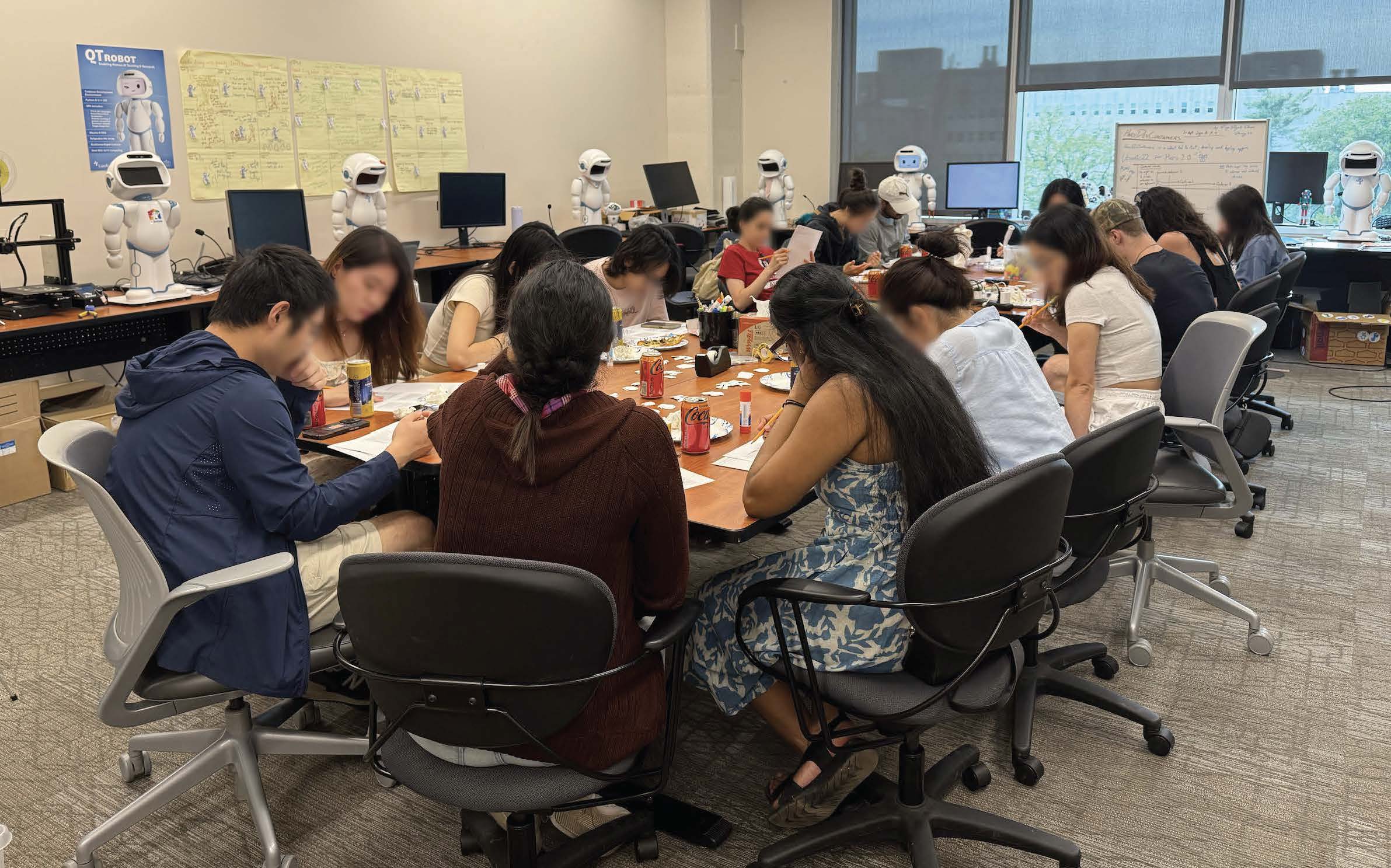 a group of younger participants seated around a table engaged in the study activities
