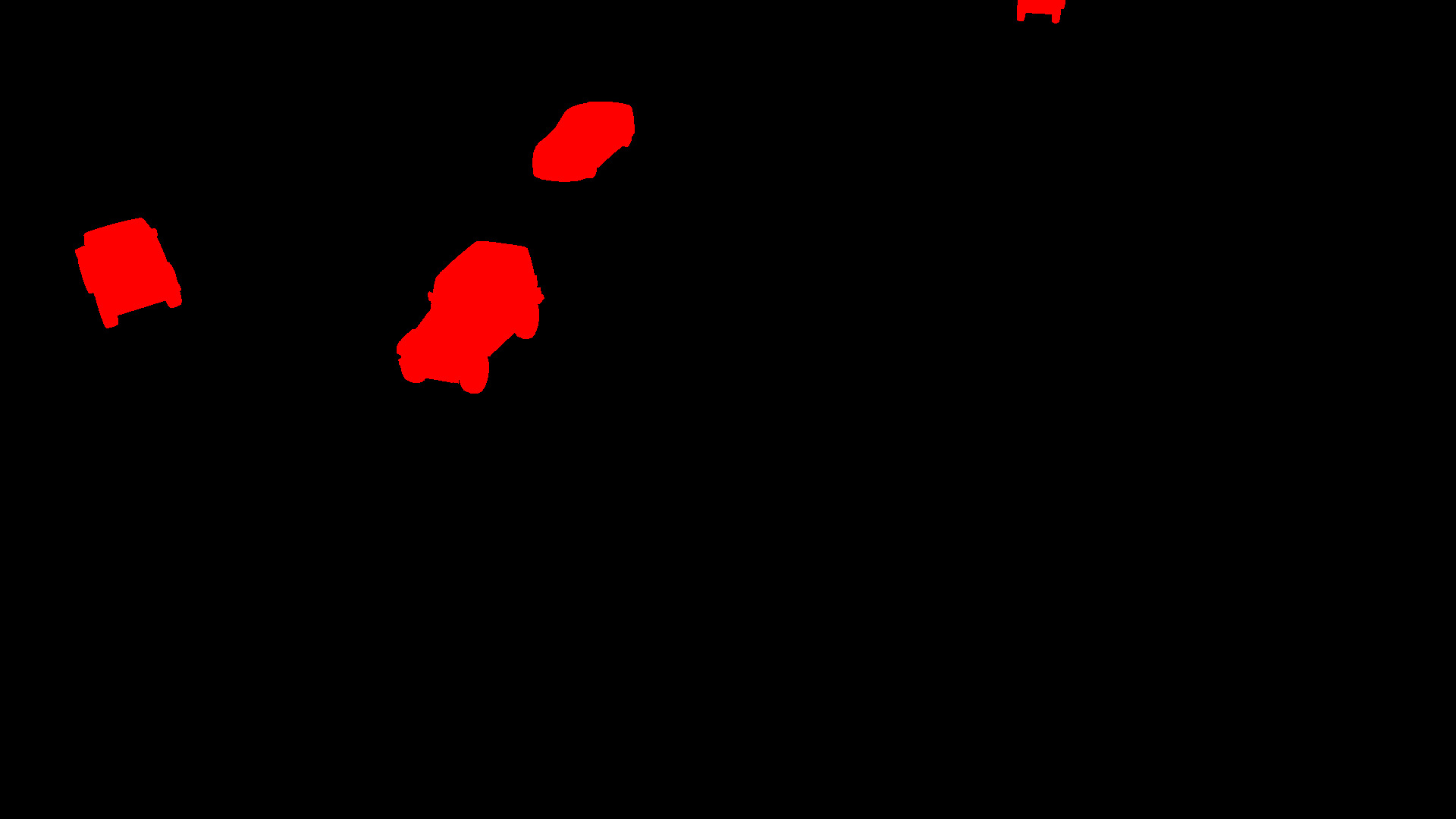 Segmentatio map of an urban scene showing three cars crossing an intersection. The cars have the same color in the segmentation map.