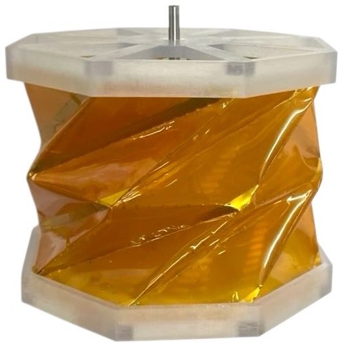 This electrostatic origami motor expands from [latex]26.5\,\text{mm}[/latex] to [latex]66.0\,\text{mm}[/latex] and maintains a stable, deployed position without external force after unfurling from its stowed configuration.