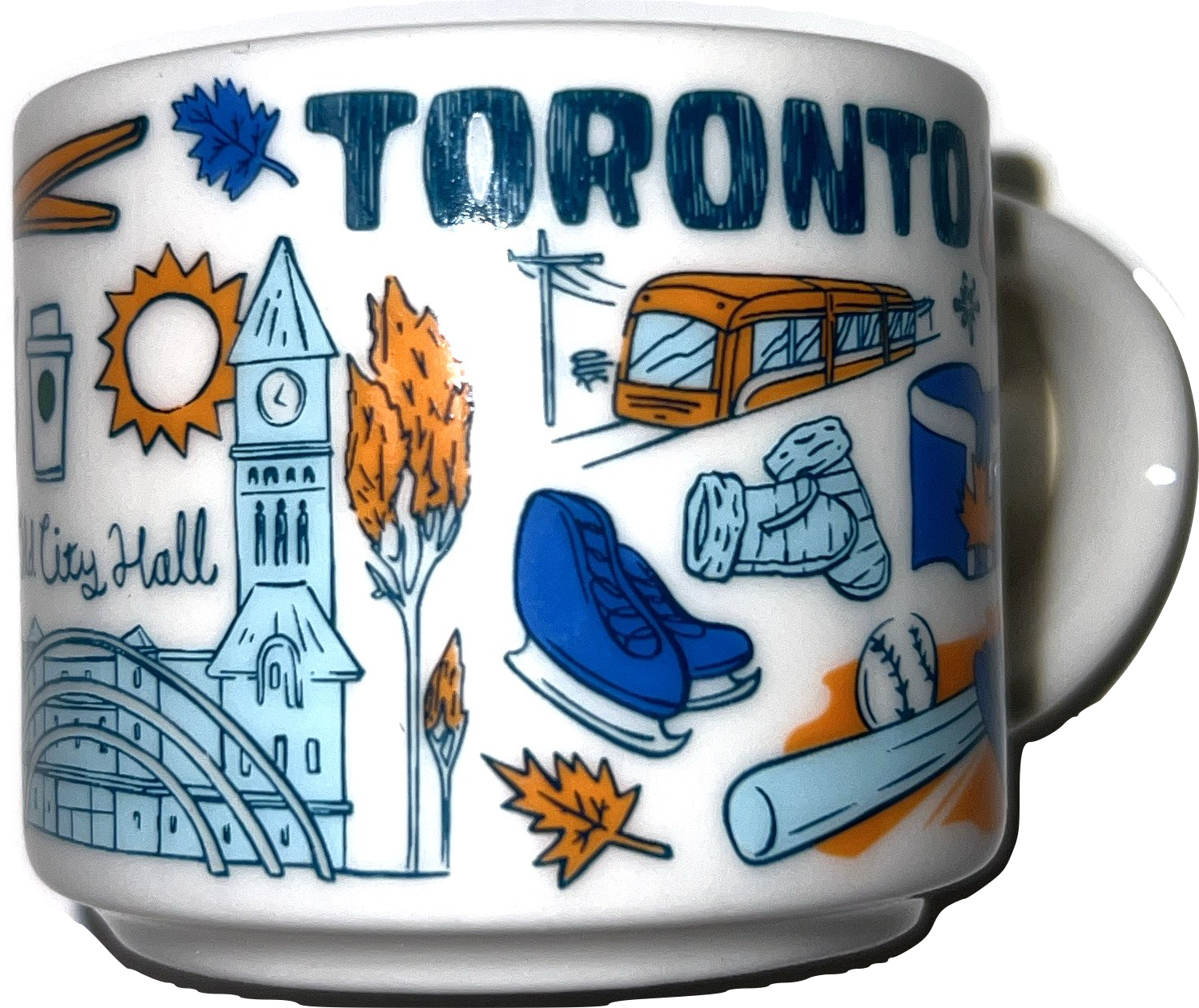 This is a ceramic coffee mug with a smooth, glossy surface and a sturdy handle. Wrapped around the mug is a colorful, cartoon-style illustration celebrating the city of Toronto, Canada. At the top, the word “TORONTO” is written in large, bold, dark blue capital letters. Below and around this, various symbols and landmarks of the city are depicted. There is an orange sun with sharp rays, and next to it a white takeaway coffee cup with a green circle, representing the city’s coffee culture. A tall clock tower with a steep triangular roof stands prominently, symbolizing Old City Hall, and beside it is a curved, modern building resembling Toronto’s current City Hall, with two tall arches spanning across the scene. Bright orange and yellow autumn leaves and trees appear throughout the design, evoking the feel of fall in the city. An orange streetcar travels along tracks, a nod to Toronto’s iconic public transportation. Sports are also featured, including a blue ice skate and a pair of white hockey gloves, showing the city’s connection to ice hockey. Nearby, there’s a blue recycling bin with a maple leaf on it, representing environmental awareness and civic pride. A baseball bat and ball lie in the lower part of the image, referencing the Toronto Blue Jays. Scattered throughout the design are additional orange and blue maple leaves, further emphasizing Canadian identity. The overall style is playful and stylized, using mostly blue, orange, and white tones to create a vibrant tribute to Toronto’s culture, sports, and landmarks.