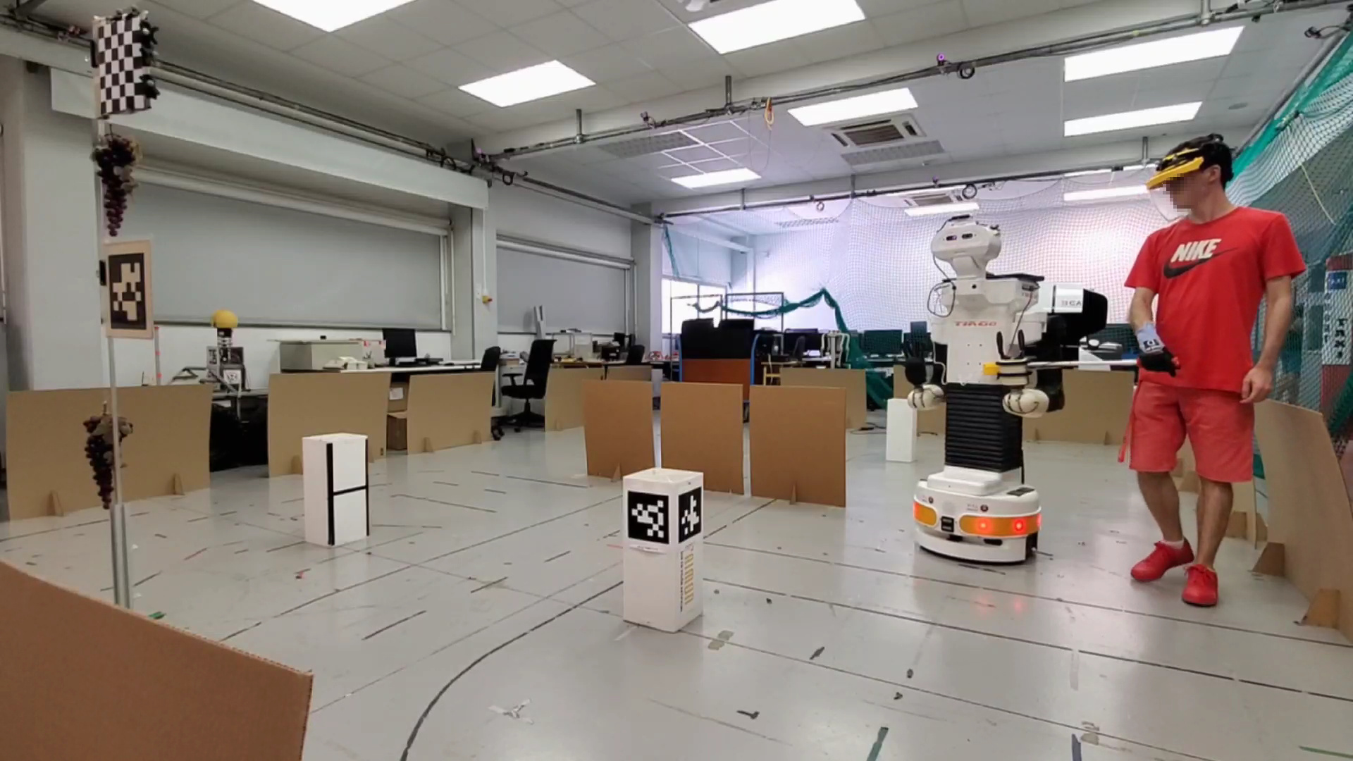 Human-robot collaboration enables shared object transportation, leveraging a wrist-mounted force sensor to infer the human's intent and handle-mounted buttons for explicit communication.